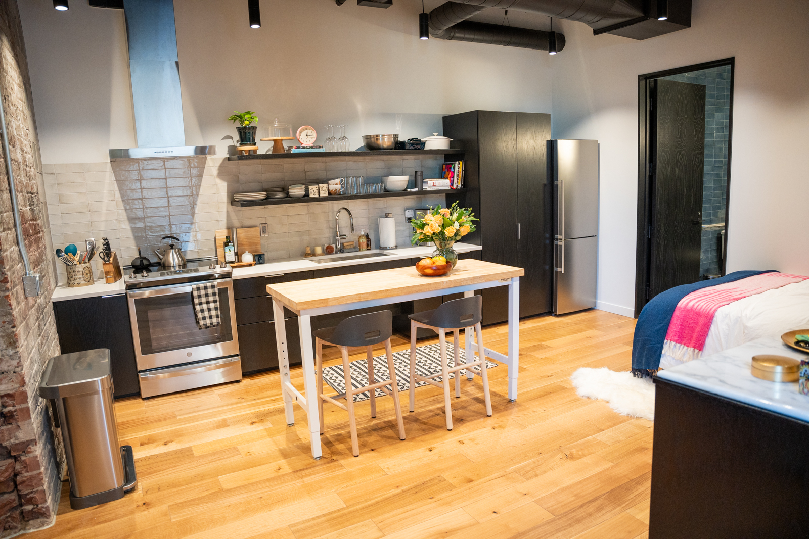 Wide view of the kitchen in the studio from the entryway