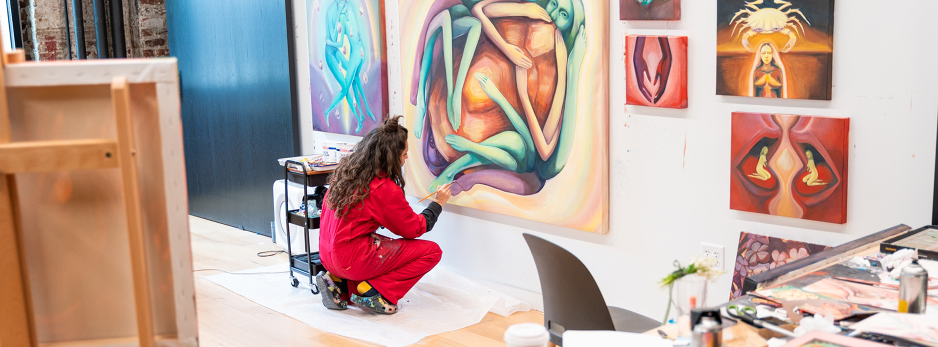 Annual appeal 2024 web cover alicia reyes Mc Namara painting in the Kali Baker Studio